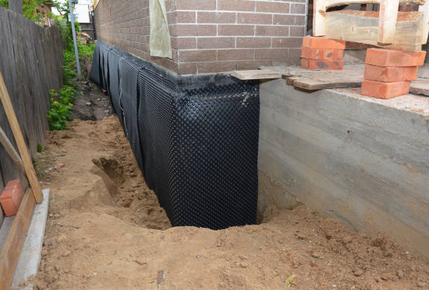 Happy homeowners after waterproofing job in Latty